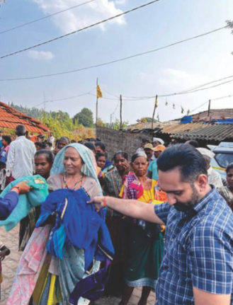 Volunteer distributing clothes