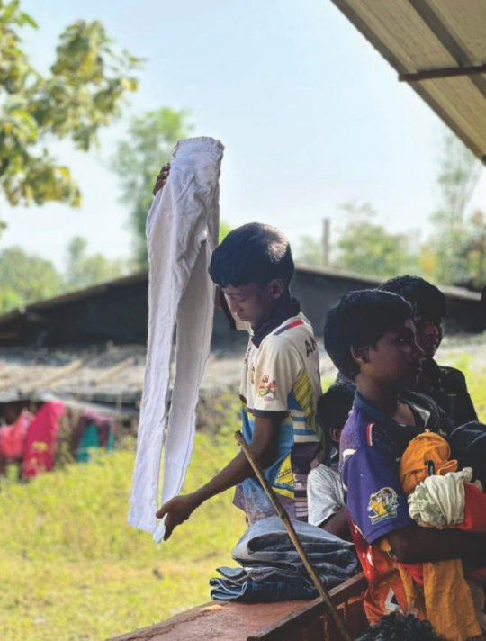 Boy receiving a shirt