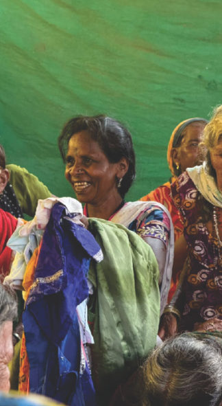 Woman smiling with new clothes, 2025