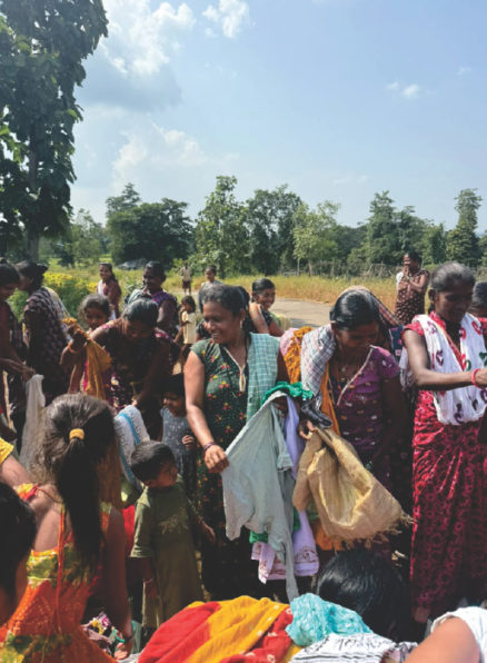 Women with clothes in a village, 2025