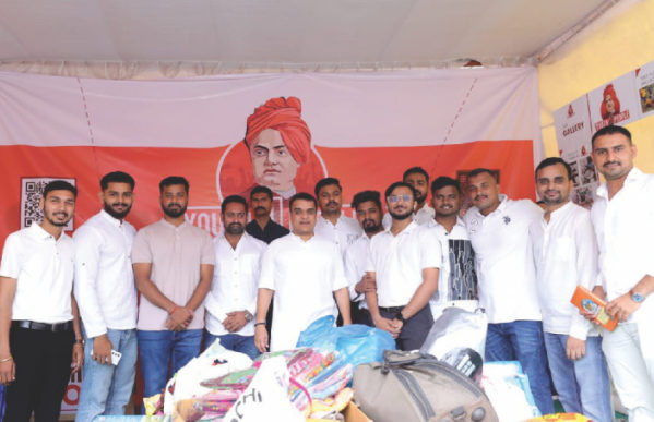 Volunteers at a Youth4People collection stall with donated clothes