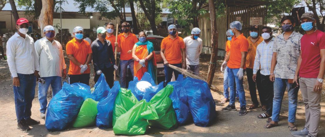 Volunteers with collected garbage bags